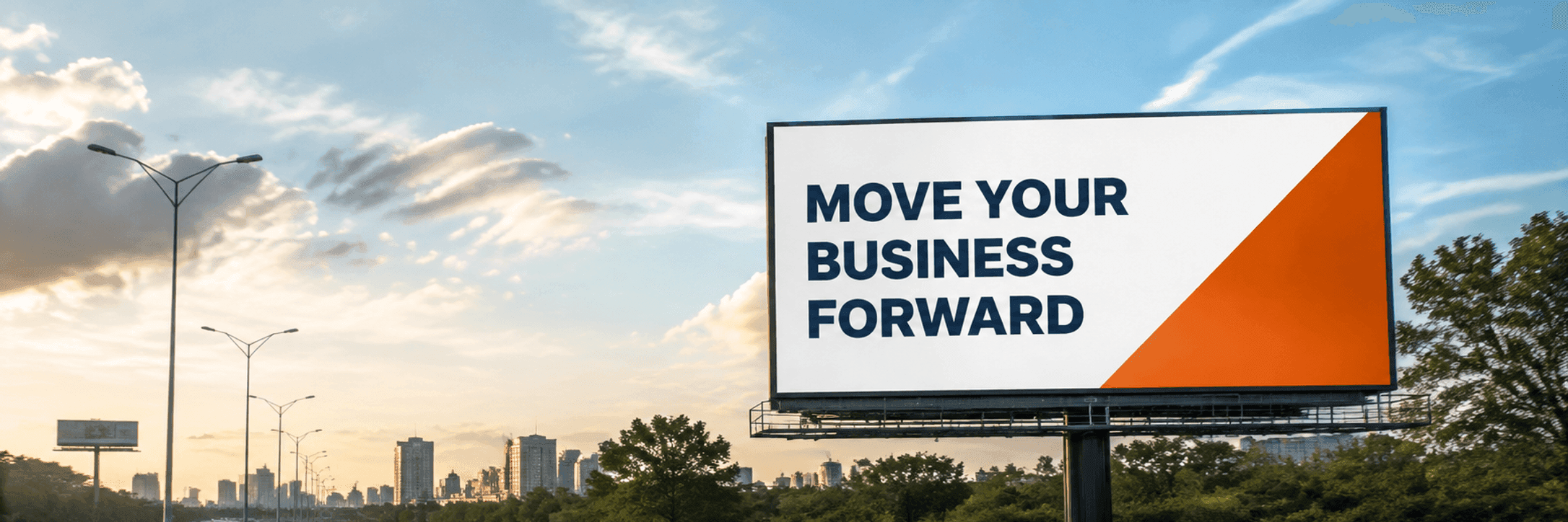 A billboard with a simple advert beside a busy road, seen from the driver's perspective.